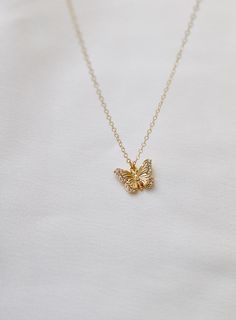 Delicate and sweet, this cubic zirconia butterfly necklace is a larger version to our Miniature CZ Butterfly Necklace . Butterflies symbolize transformation and hope which will make this a beautiful addition to your collection Materials: gold plate with cubic zirconia details Length: 18" gold chain SKU: CN1467G Materials+Care Dainty Diamond Necklace With Butterfly Charm, Delicate Butterfly Jewelry With Cubic Zirconia, Delicate Butterfly-shaped Jewelry With Cubic Zirconia, Delicate Butterfly Cubic Zirconia Jewelry, Delicate Butterfly-shaped Cubic Zirconia Jewelry, Delicate Jewelry With Cubic Zirconia Butterfly Charm, Dainty Gold Butterfly Charm Necklace, Dainty Gold Butterfly Necklace With Delicate Chain, Delicate Gold Butterfly Charm Necklace