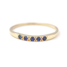 Dainty sapphire ring with five 1.5 mm blue sapphires in 18k soild gold. Can be a beautiful alternative wedding band. Materials: 18k solid gold, five 1.5 mm royal blue sapphires ► Choose your gold color > yellow gold / white gold / rose gold This design is also available with: ► Emeralds: https://www.etsy.com/il-en/listing/222378844 ► Rubies: https://www.etsy.com/il-en/listing/222379810 ► Turquoise: https://www.etsy.com/il-en/listing/180505967 ► Black diamonds: https://www.etsy.com/il-en/listi Wedding Ring Dainty, Boho Engagement Ring, Sapphire Wedding Ring, Dainty Wedding Band, Alternative Wedding Bands, Sapphire Wedding Rings, Sapphire Wedding Band, Sapphire Band, Blue Ring