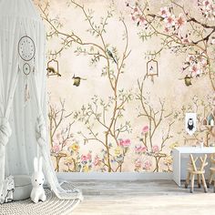 a room with flowers and birds on the wall