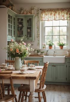 a wooden table sitting in front of a window filled with flowers