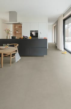 the kitchen is clean and ready to be used as a dining room or living room