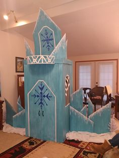 a castle made out of cardboard with snowflakes on it