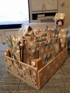 some brown bags are in a holder on the counter