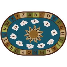 a rug with clouds and sun in the center on top of it, surrounded by letters