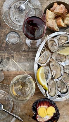 oysters and wine on a wooden table