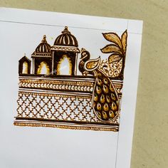 an intricately designed piece of paper with a building in the middle and a bird on top