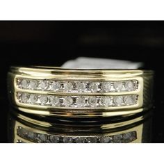 a gold ring with three rows of diamonds