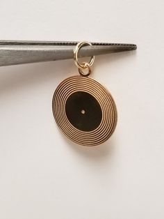 "Thanks for shopping our vintage estate store. We tend to sell well below wholesale and truly hope you enjoy all of our items. Many of the items are one of a kind, so please enjoy scrolling through the pictures and hopefully something will catch your eye. Estate 14k yellow gold vinyl album pendant or charm.  Pendant Size: 3/4\" by 3/4\" Bail: 2.5mm Weight: 0.92 gram Marked 14k gold and is a beautiful pendant." Retro Gold Jewelry Stamped 14k, Retro Gold Engraved Jewelry, Retro Engraved Gold Jewelry, Retro 14k Stamped Round Jewelry, Elvis Kiss, Gold Vinyl, Rock N, Rock N Roll, Charm Pendant