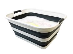 a black and white plastic tub with foam on it's sides, filled with water