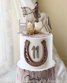 a birthday cake with a horse and rider on top