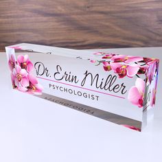 a pink and white box with flowers on it