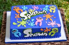 a birthday cake with the name siddon on it in front of some green grass