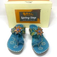 Features: Slogan: Comfort With Every Step Leather Toe Divider/Thong Sandal Gives Your Casual Attire A Unique Edge Hand Painted Leather Upper Instep Velcro Strap With Hook And Loop Closure Beautiful Floral Design And Embellishments With Ornament Accent Comfort Cushioned Footbed Molded Wedge Heel Comes With Original Box Spring/Summer/Floral/Embellishment/Comfortable/Walking Sandal/Slip On Size: 36 / 6 (Us) Condition: Pre-Owned; Excellent Condition; No Flaws Noted; Nwot Ship Same Or Next Business D Blue Adjustable Sandals With Single Toe Strap, Blue Sandals With Adjustable Single Toe Strap, Blue Sandals With Single Toe Strap And Adjustable Fit, Adjustable Light Blue Sandals For Spring, Blue Bohemian Sandals For Spring, Bohemian Blue Sandals For Summer, Closed Toe Turquoise Sandals For Summer, Turquoise Closed Toe Sandals For Summer, Blue Bohemian Sandals For Vacation