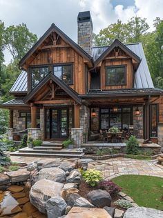 a large house with lots of windows and rocks