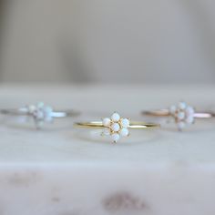 Delicate opal ring, that is perfect for stacking or wearing alone. A true beauty and must have! MATCHING EARRINGS AVAILABLE! https://www.etsy.com/listing/689209780/gold-fill-opal-stud-earrings-small-studs?ref=shop_home_active_39&pro=1&frs=1 ☆ Details ☆ * Made of 925 Sterling Silver * Available in 14k Gold Plating, Rose Gold Plating or Rhodium Plated * We use a THICK, DURABLE 14k GOLD plating - for a piece that will last you years to come! * VERY HIGH QUALITY * Available in sizes 4-10 * F Wedding Rings Simple Opal, Affordable Minimalist Spring Rings, Dainty Opal Ring, Pink Sapphire Band, Gold Opal Ring, Opal Stacking Ring, Sterling Silver Opal Ring, Huggie Earrings Gold, Natural Opal Ring