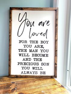 a sign that says, you are loved for the boy in the man you will become and the precious son you will always be