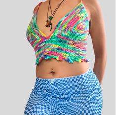 Feel the vibrant energy of the summer with our Rainbow Starr Top! This cropped top features a playful rainbow design that will make you stand out at any festival or night out. The corset backing adds a touch of sensuality, making it perfect for the end of summer. Get ready to make a statement and have some fun in this must-have top! Playful Crop Top For Summer, Playful Cropped Crop Top For Spring, Multicolor Y2k Tank Top For Spring, Y2k Multicolor Tank Top For Spring, Y2k Style Multicolor Tank Top For Spring, Trendy V-neck Top For Festivals, Colorful Hippie Tops For Spring, Playful Summer Crop Tops, Playful Cropped Tops For Spring