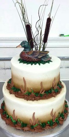 a three tiered cake decorated with leaves and flowers