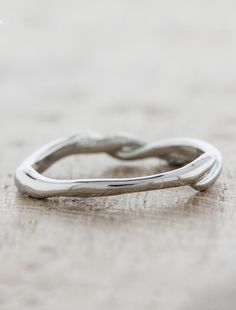 Our Jenka combines sculpture and symbolism. She features an elegantly contoured twisted band that turns like life and the union of marriage, symbolizing the merging of two paths into one destiny. Pairs beautifully with the Landress and Mandy engagement rings. Approx Band Width (mm): 1.90 mm Setting Diamond Quality (side stones): Colorless and VS clarity Approx Setting Total Carat Weight (side stones): n/a Approx Production Time: 4-5 weeks Branch Wedding Band, Ken And Dana Designs, Two Paths, Twist Wedding Band, Twisted Band, Unique Wedding Bands, The Union, Ring Fit, Home Wedding