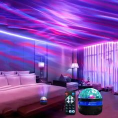 a bedroom with purple and blue lights on the ceiling