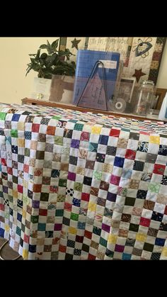 a quilted table cloth on top of a chair