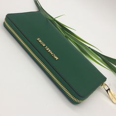 Michael Kors Leather Continental Wristlet Phone Case Wallet Fern Green Nwt New With The Tag Authentic In A Timeless Hue And Ultra-Luxe Texture, You’ll Want To Keep Our Jet Set Travel Wallet Within Reach. Crafted From Saffiano Leather, This Classic Accessory Showcases An Elongated Shape With Gold-Tone Accents And A Continental Zip Closure. 100% Leather From Tanneries Meeting The Highest Standards Of Environmental Performance From Tanneries Meeting The Highest Standards Of Environmental Performanc Michael Kors Wallet With Mobile Phone Bag, Green Clutch With Zipper Closure, Michael Kors Wallet With Zipper Closure For Everyday, Michael Kors Rectangular Everyday Clutch, Everyday Michael Kors Rectangular Clutch, Michael Kors Clutch With Zipper Closure, Elegant Michael Kors Wallets For Daily Use, Elegant Green Wallets For Travel, Green Zipper Clutch Wallet