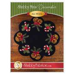 a christmas wreath with holly and candy canes on it