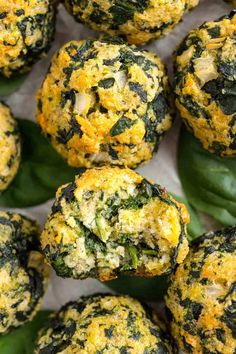 spinach and cheese muffins are piled on top of each other