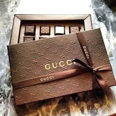 a gucci box with chocolates in it