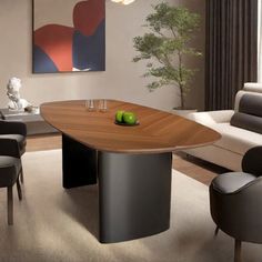 a modern dining table with chairs around it in a living room next to a couch