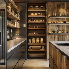 a kitchen with lots of wooden shelves filled with food