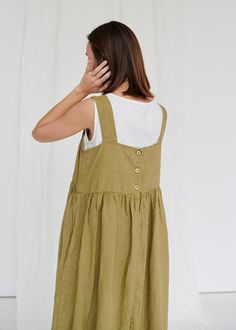 "The Summer dress has three buttons in the back, two side inseam pockets and a wide hem gathered below the bust. The bodice is double-layered, so you can wear the dress braless. We like how the dress looks on its own, but we also love it layered with a shirt. The dress does not include the Luna top featured in the picture. SIZING & FIT This garment is a loose-fitting cut. If you want to wear this piece as close-fitting, select a smaller size than you usually wear. Before placing an order, check Watermelon Dress, Olive Dress, Emerald Green Dresses, Summer Linen Dresses, Peach Dress, Dress Linen, Summer Linen, Oversized Dress, Pinafore Dress