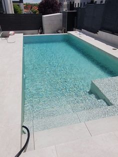 an empty swimming pool on top of a building