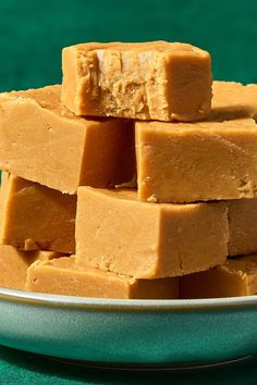 several pieces of peanut butter fudge stacked on top of each other in a bowl