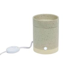 a white and beige ceramic cup with a mouse