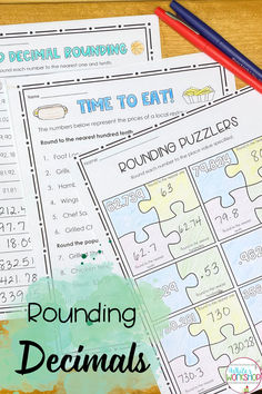 two puzzles with the words rounding and numbers on them, next to pencils and markers