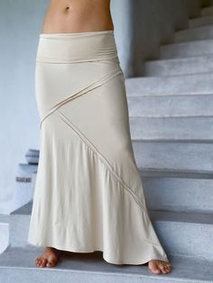 women's stretchy rayon jersey cream maxi skirt with raised stitch detail #color_cream Spring Flared Skirt Bottoms In Elastane, Spring Flare Skirt With Stretch, Fitted Flare Maxi Skirt For Spring, Flare Skirt With Stretch For Spring, Stretch Flare Skirt For Spring, Casual Flared Fitted Skirt, Spring Flare Stretch Maxi Skirt, Flowy Wide Hem Maxi Skirt, Versatile Fitted Maxi Skirt For Summer