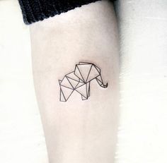 an origami horse tattoo on the left inner arm