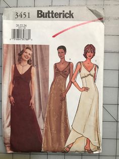 two women's evening gowns, one in brown and the other in white