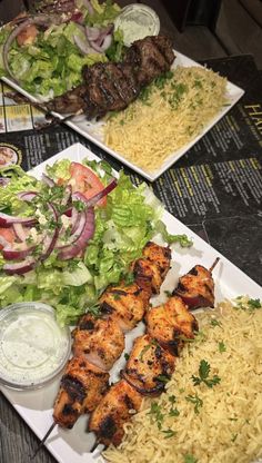 three plates filled with different types of food on top of a table next to each other