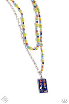 A strand of silver paperclip chain collides with a mismatched layer of various orange, yellow, and green seed beads with silver accents to create an abstract blend of color and glitz. A royal blue-painted rectangle pendant, featuring the word "AWESOME" in various colors with fun shapes making up some of the letters, dangles from the bottom of the abstract display for additional fun-loving flourish. A similarly-beaded chain hovers above the bodacious collection, perfectly balancing the contrastin November Fashion, Multi Necklace, Dainty Band, Rectangle Pendant, Blue Pendant, Yellow And Green, Paparazzi Jewelry, Pink Stone, Seed Bead Jewelry