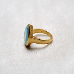 D E T A I L S - Material: 925 Sterling Silver Stone: Aqua Chalcedony The fit: True to US ring size Finish: Textured and Gold Plated to a high shine Upgrade your accessory collection today with this must-have piece, & flaunt your style statement S H I P P I N G & P R O D U C T I O N - My current production time is 2-6 business days, which means after those days are up, your order ships! I make everything custom to order, by hand, but I promise you it's worth the wait! R U S H - M Y - O R Handmade Gold Chalcedony Rings, Adjustable Round Chalcedony Ring, Green Turquoise Cabochon Ring, Silver-setting Turquoise Cabochon Ring, Aqua Chalcedony Ring, Chalcedony Ring, Textured Ring, Aqua Chalcedony, Everyday Rings