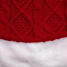 a red and white knitted santa hat