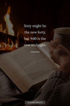 someone is reading a book and holding a coffee cup in their hand with the words sixty might be the new forty, but 900 is the new midnight