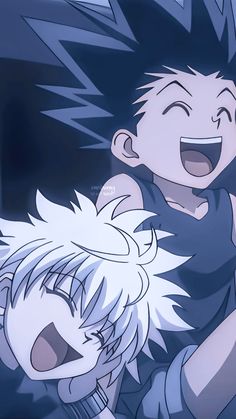 two young boys are laughing and having fun