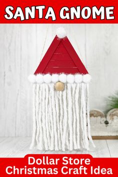 a red and white santa gnome decoration hanging from a string with the words dollar store christmas craft idea