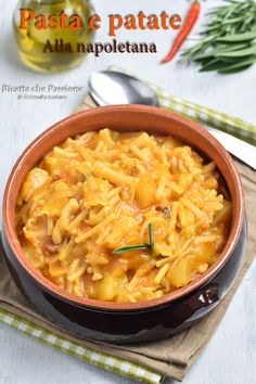 pasta e patate all'anapoleetana in a brown bowl on a table