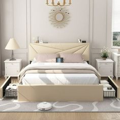 a bedroom with a bed, dressers and lamps