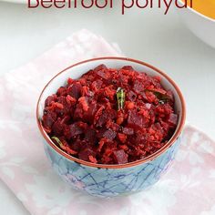 a bowl filled with beetroot and carrots on top of a pink napkin