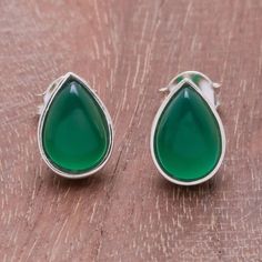 Gleaming beautifully two teardrops of green onyx are displayed within this pair of stud earrings from Thailand. Narinee creates these earrings framing each gemstone in high-polish sterling silver. Green Gemstone Teardrop Earrings, Green Teardrop Gemstone Earrings, Luxury Green Teardrop Gemstone Earrings, Pandora Leather Bracelet, Earring Frame, Graduation Rings, Carnelian Earrings, Onyx Colour, Marcasite Jewelry